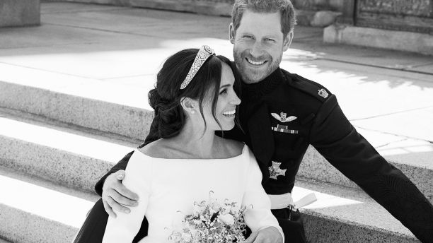 This photo released by Kensington Palace on Monday May 21, 2018, shows an official wedding photo of Britain's Prince Harry and Meghan Markle, on the East Terrace of Windsor Castle, Windsor, England, Saturday May 19, 2018. (Alexi Lubomirski/Kensington Palace via AP)