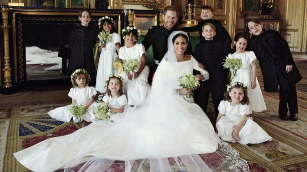 In this photo released by Kensington Palace on Monday May 21, 2018, shows an official wedding photo of Britain's Prince Harry and Meghan Markle, center, in Windsor Castle, Windsor, England, Saturday May 19, 2018. Others in photo from left, back row, Brian Mulroney, Remi Litt, Rylan Litt, Jasper Dyer, Prince George, Ivy Mulroney, John Mulroney; front row, Zalie Warren, Princess Charlotte, Florence van Cutsem. (Alexi Lubomirski/Kensington Palace via AP)