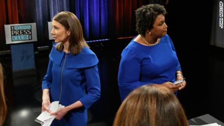 They both grew up poor and are running as Democrats, but Stacey Evans, left, and Stacey Abrams are emphasizing how different they are. 