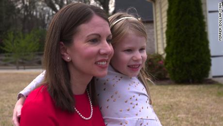 Stacey Evans, pictured with her daughter, says she can win support from moderates and disillusioned Republicans.