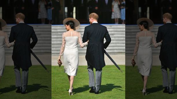 Meghan, the Duchess of Sussex and her husband Prince Harry walk as they attend a garden party at Buckingham Palace in London, Tuesday May 22, 2018, their first royal engagement since marrying on Saturday. The event is part of the celebrations to mark the 70th birthday of Prince Charles.  (Dominic Lipinski/Pool Photo via AP)