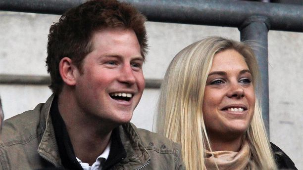 Britain's Prince Harry (L) and Chelsy Davy attend the friendly international rugby union match between England and Australia at Twickenham in London November 7, 2009.   REUTERS/ Eddie Keogh (BRITAIN ROYALS SPORT RUGBY) - GM1E5B802ZC01