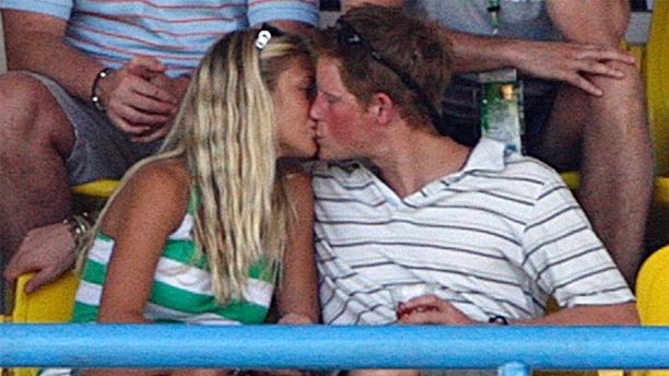 Britain's Prince Harry (R) kisses his girlfriend Chelsy Davy as England plays Australia during their World Cup cricket Super Eights match in St. John's April 8, 2007.   MOBILES OUT, EDITORIAL USE ONLY REUTERS/Darren Staples    (ANTIGUA AND BARBUDA) - GM1DUZQUXEAA