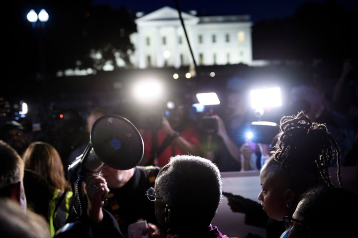 Bishop Michael Curry (C) waits to speak during a vigil outside the White House on May 24, 2018 in Washington, D.C.