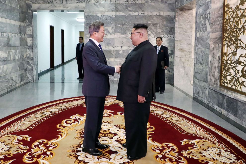 PHOTO: South Koreas President Moon Jae-in (L) shakes hands with North Koreas leader Kim Jong Un before their second summit at the north side of the truce village of Panmunjom in the Demilitarized Zone (DMZ) on May 26, 2018.
