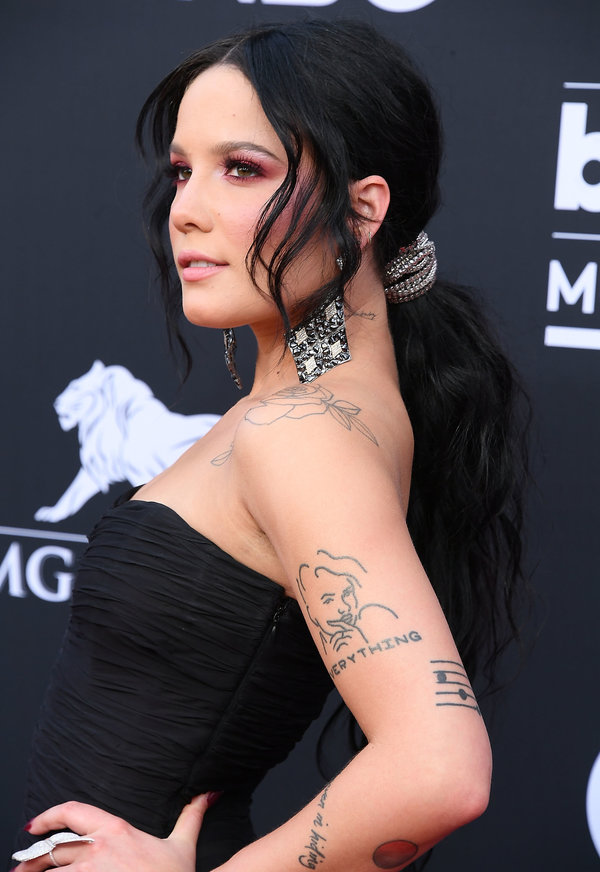Halsey's low ponytail with tendrils framing her face is the perfect look for a romantic date night.