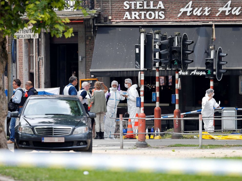 PHOTO: Police officers and forensics experts are seen on the scene of a shooting in Liege, Belgium, May 29, 2018.