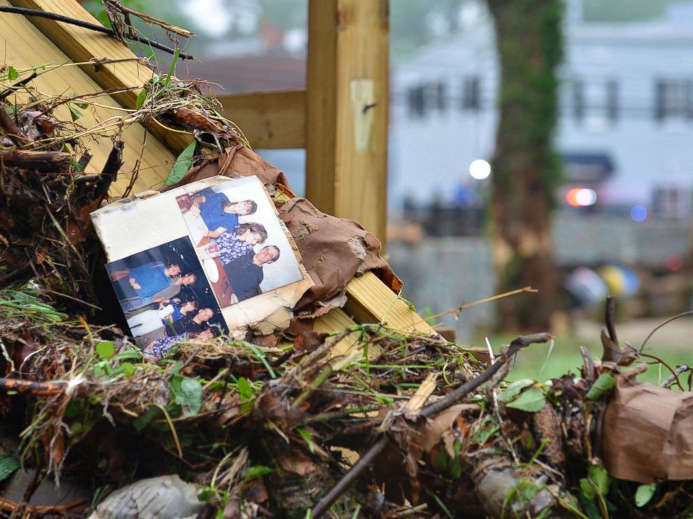 PHOTO: Family photos rest among debris after flash flooding in Ellicott City, Md., May 28, 2018. 