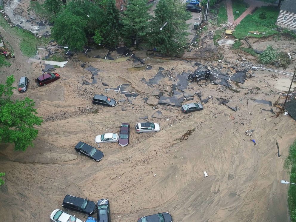 PHOTO: This image made from video provided by DroneBase shows vehicles swept by floodwater near the intersection of Ellicott Mills Drive and Main Street in Ellicott City, Md., May 28, 2018.