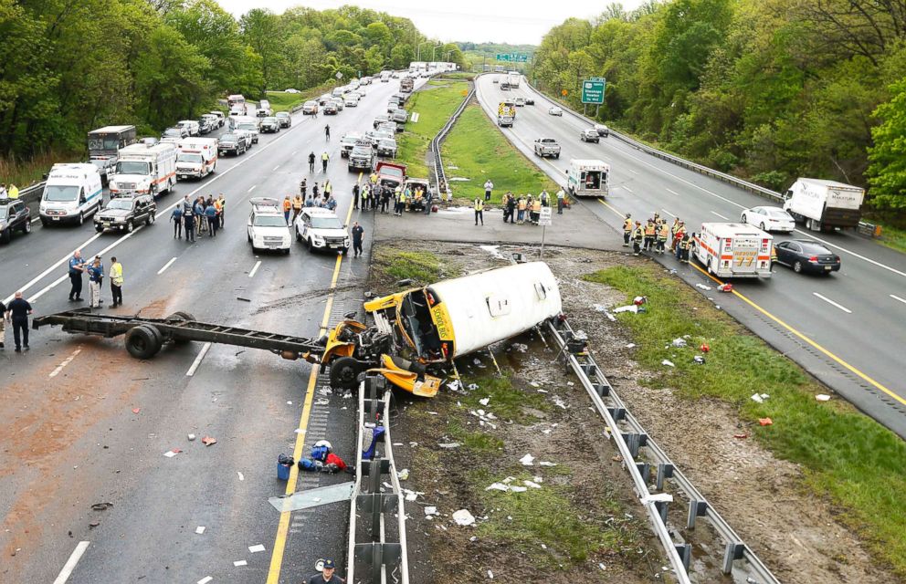 PHOTO: Emergency crews respond to the scene of a crash between school bus carrying middle school students and dump truck on a New Jersey highway, May 17, 2018.