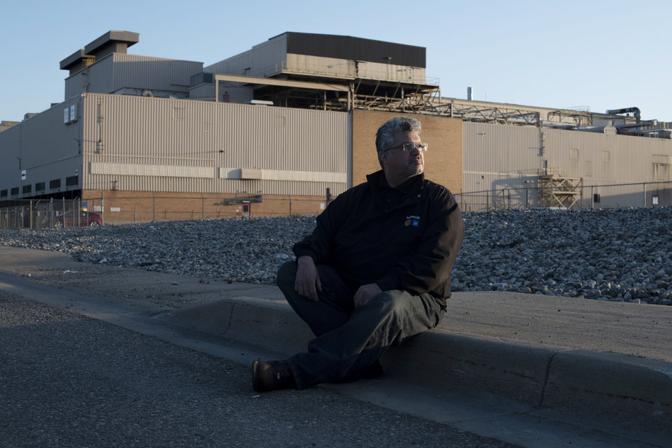 Reyes sits outside the GM Flint Assembly Plant, where he&nbsp;works as an electrician, April 29.