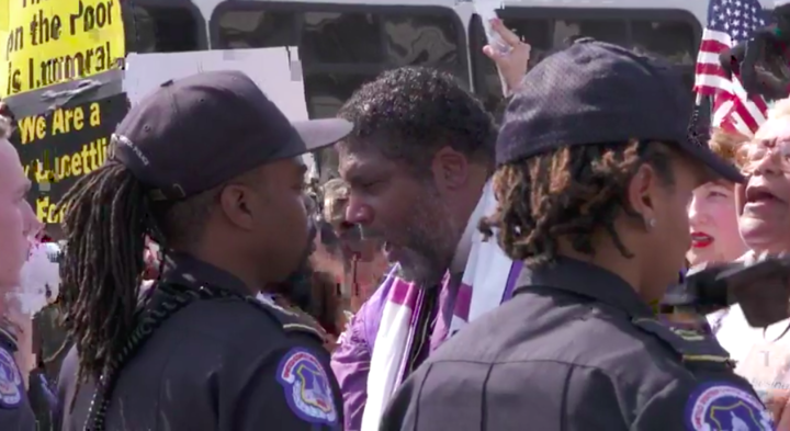 Rev. Barber chants in front of&nbsp;the police line at a Washington, D.C., rally.