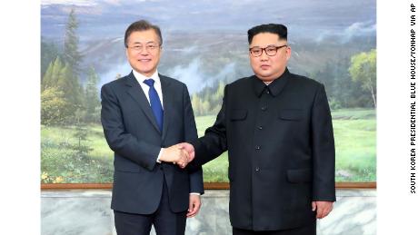 The North and South Korean leaders greet each other before Saturday&#39;s meeting.