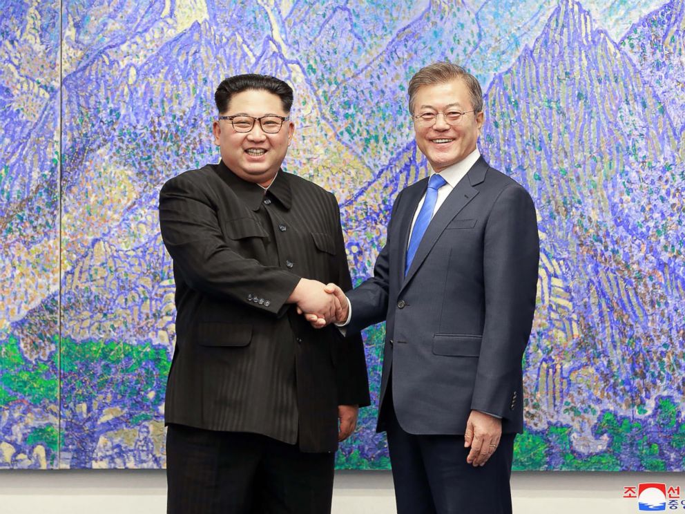PHOTO: North Koreas leader Kim Jong Un (L) is pictured shaking hands with South Koreas President Moon Jae-in (R) during the Inter-Korean summit in the Peace House building on the southern side of the truce village of Panmunjom, April 27, 2018.