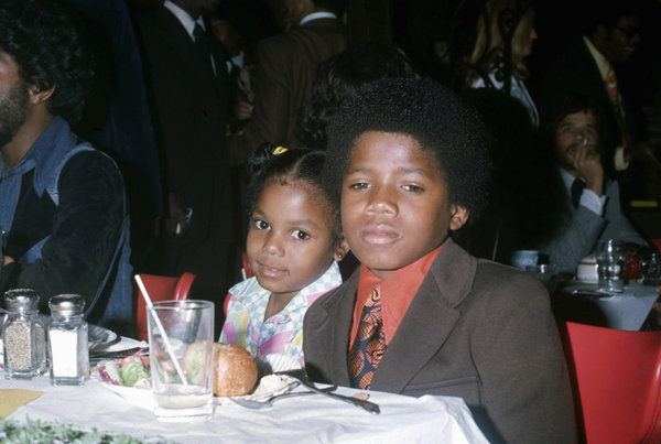 With her brother Randy Jackson.&nbsp;