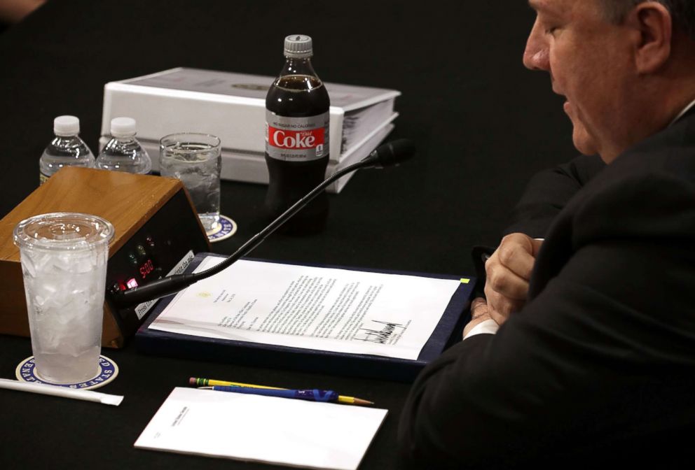 PHOTO: Secretary of State Mike Pompeo reads President Donald Trumps letter to North Korean leader Kim Jong Un before Pompeo testifies to the Senate Foreign Relations Committee, May 24, 2018 in Washington, DC. 