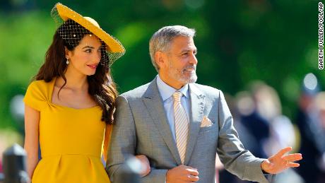 Amal Clooney and George Clooney arrived looking like they go to royal weddings every week. 