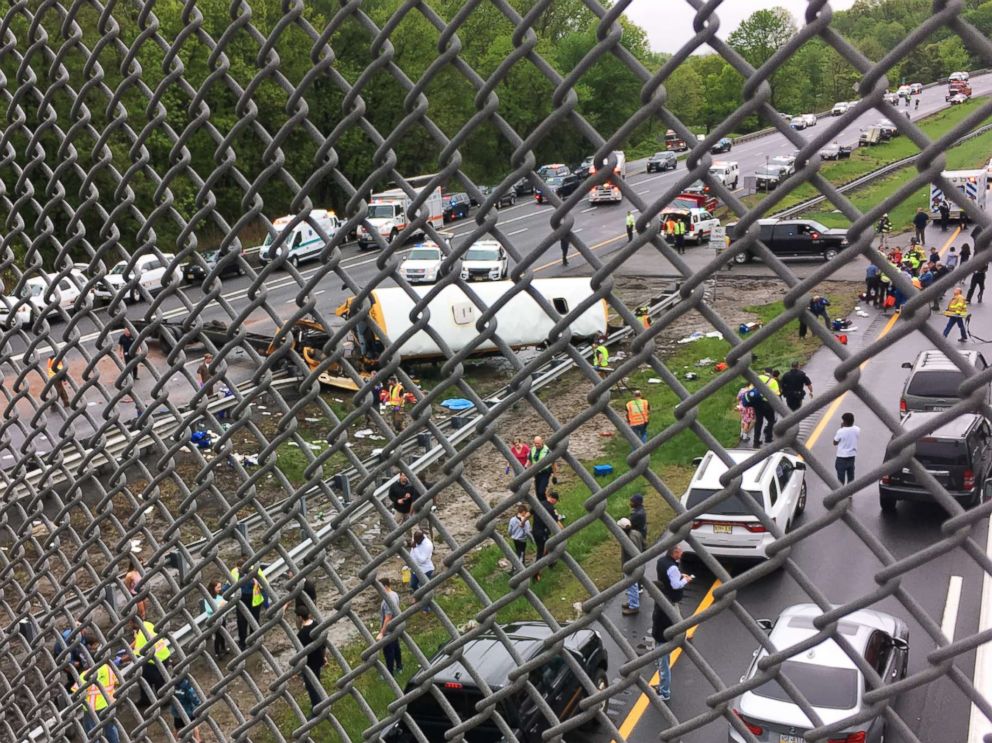 PHOTO: Vehicles stop at the scene where a school bus collided with a dump truck near Mount Olive Township, N.J.