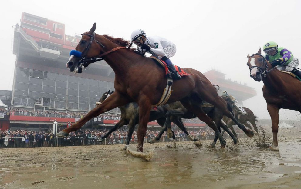 PHOTO: Justify, with Mike Smith aboard, wins the 143rd Preakness Stakes horse race at Pimlico race course in Baltimore, May 19, 2018.
