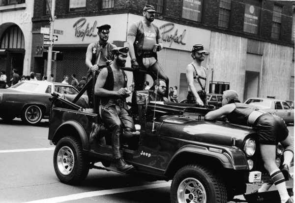 A group of men&nbsp;ride in a truck at the intersection of 32nd Street and Fifth Avenue during the annual gay Pride parade in