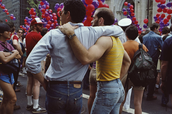 Two men watching the gay Pride parade in New York City, June 1984.