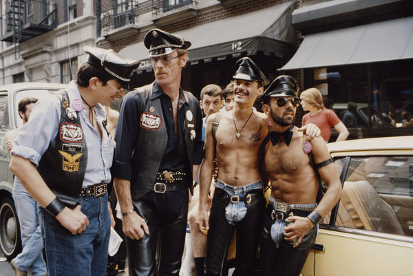 A group of men relax on the street during the gay Pride parade in New York City, June 1982.
