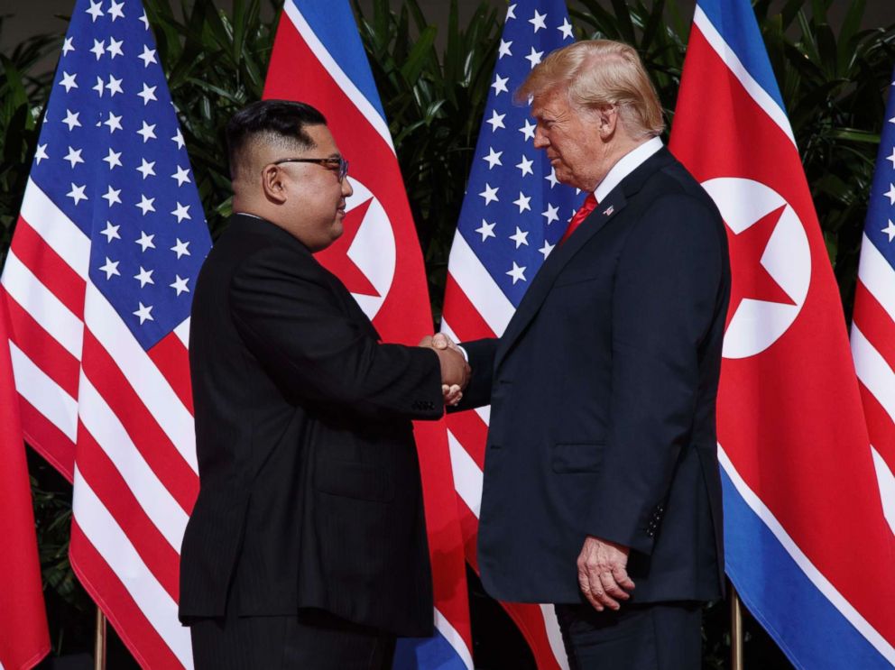 PHOTOS: Trump goes face to face with Kim in historic summit with North Korea