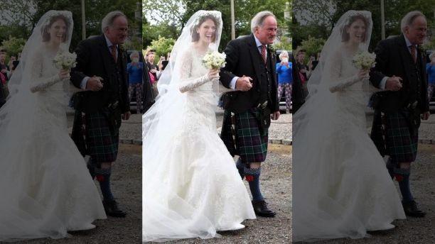 Rose Leslie is escorted by her father Sebastian as they arrive for her wedding at Rayne Church, Kirkton of Rayne in Aberdeenshire, Scotland, Saturday June 23, 2018. Former "Game of Thrones" co-stars Kiet Harington and Rose Leslie are set to marry near the bride's family castle in Scotland. Fans of the show gathered outside 900-year-old Wardhill Castle in northeast Scotland to catch a glimpse of the two British actors. (Jane Barlow/PA via AP)