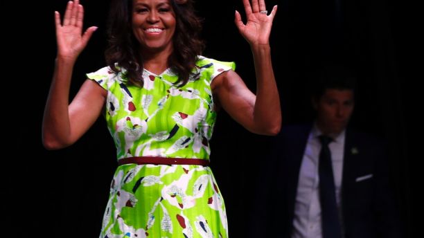 Former first lady Michelle Obama waves as she arrives to speak at the American Library Association annual conference in New Orleans, Friday, June 22, 2018. (AP Photo/Gerald Herbert)