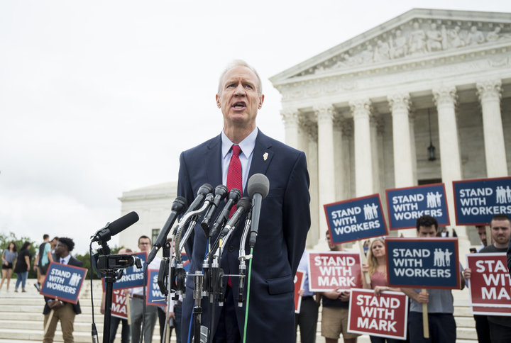 Illinois Gov. Bruce Rauner (R) speaks outside the U.S. Supreme Court after&nbsp;its decision on Wednesday.