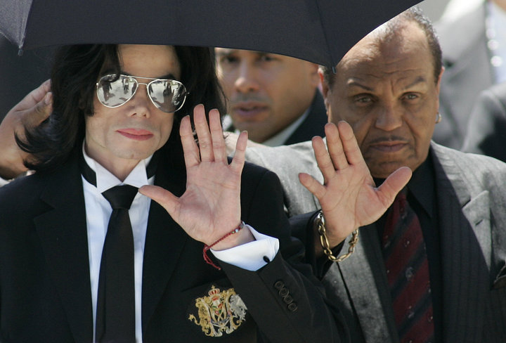 Michael Jackson and father Joe leave the Santa Barbara County courts after Michael was acquitted on all 10 charges in his chi