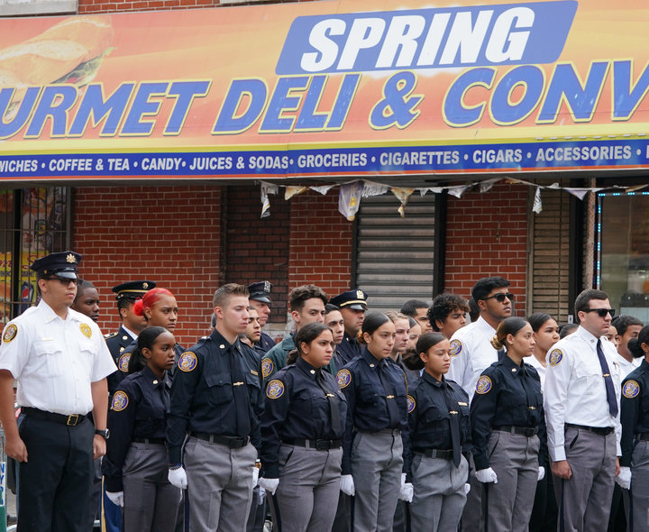 Members of the NYPD Junior League stand outside of&nbsp;Our Lady of Mount Carmel in the Bronx on Wednesday ahead of the funer