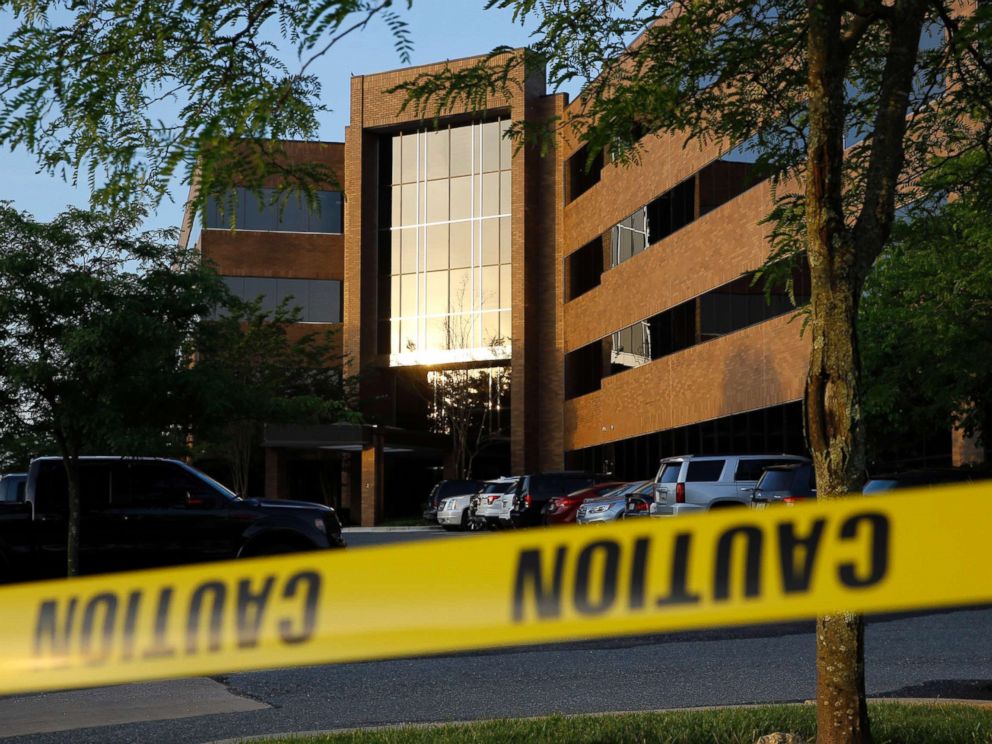 PHOTO: Crime scene tape surrounds a building housing The Capital Gazette newspapers offices, June 29, 2018, in Annapolis, Md.