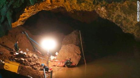 Thai soldiers walk out of the entrance to the Tham Luang Nang Non cave, Friday, June 29.