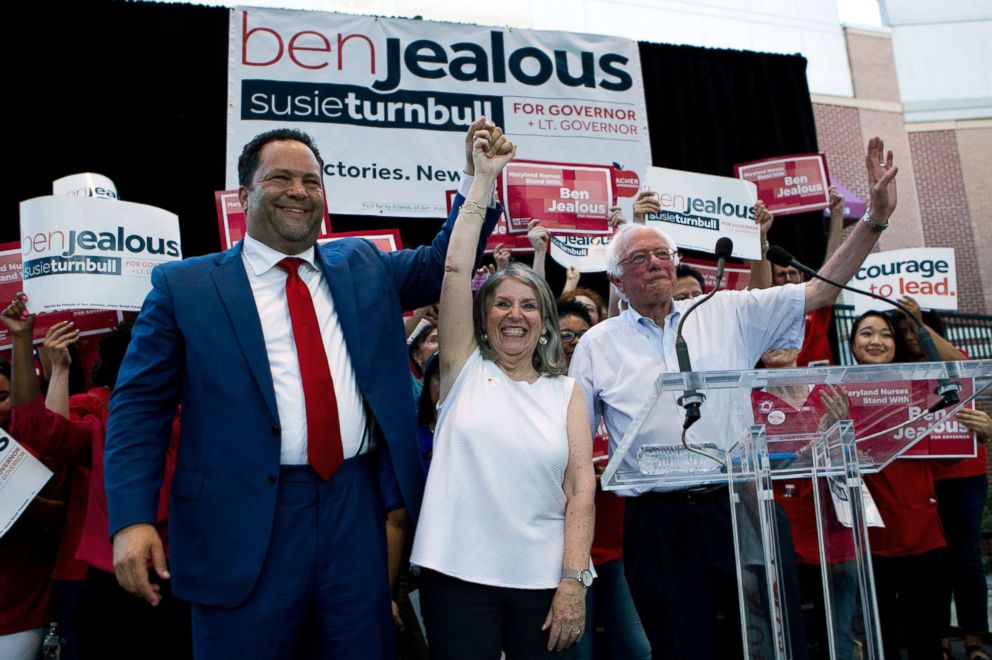 PHOTO: From left, Democrat Ben Jealous raises the hand of his running mate Susie Turnbull while Sen. Bernie Sanders waves during a gubernatorial campaign rally in Marylands Democratic primary in downtown Silver Spring, Md., June 18, 2018.