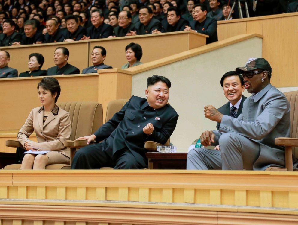 North Korean leader Kim Jong Un watches a basketball game between former NBA basketball players and North Korean players of the Hwaebul team of the DPRK with Dennis Rodman, right, at Pyongyang Indoor Stadium in this undated photo in Pyongyang.