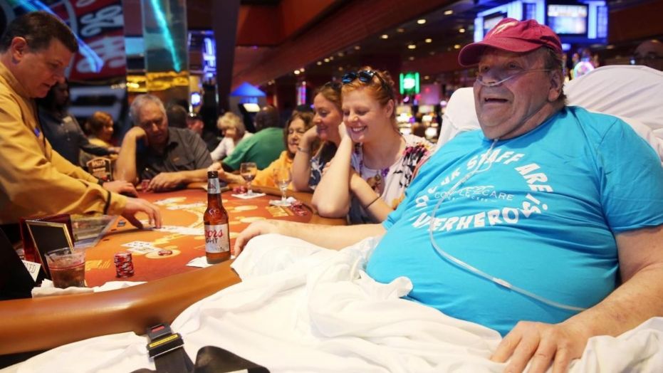 Mudry arrived at Bally's via ambulance on Tuesday, and had his bed placed next to a blackjack table where he enjoyed a Coors Light.