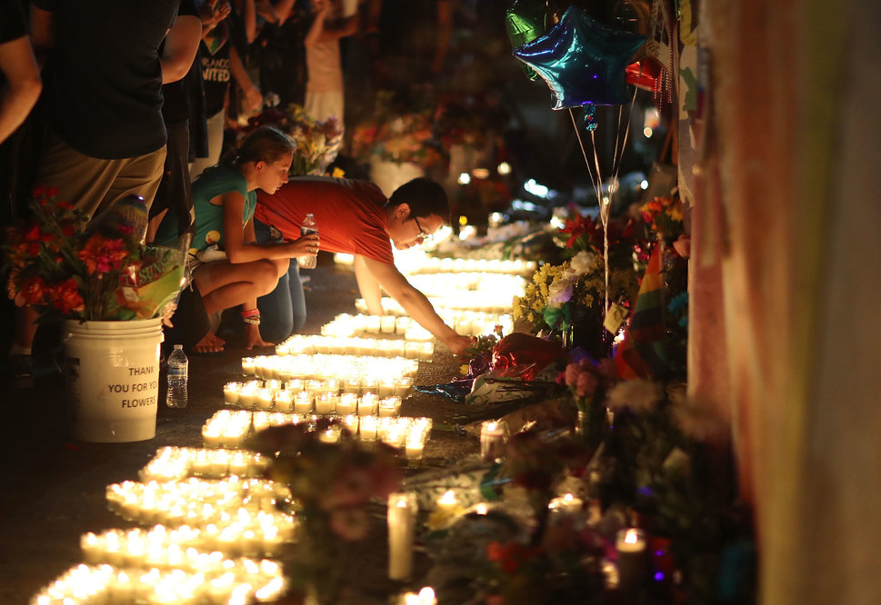 People visit&nbsp;a makeshift&nbsp;memorial outside Pulse on June 12, 2017, one year after a gunman killed 49 people there. S