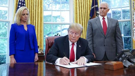 Trump reverses course, signs order to keep families together
