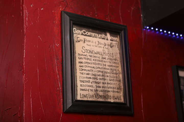 A news clipping on the historic 1969 riots hanging on the wall at New York's Stonewall Inn.