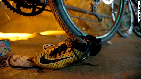 A pair of soccer shoes left at the entrance of the Tham Luang Nang Non caves.