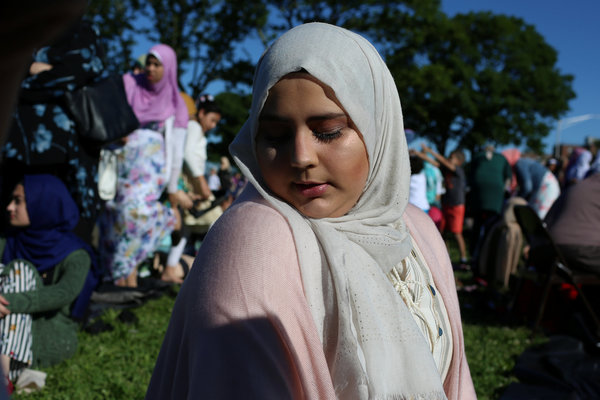 A Muslim woman prays at Bensonhurst Park in Brooklyn, New York, to celebrate Eid al-Fitr on June 15, 2018.