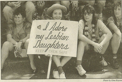 Frances Goldin holds her sign at an early Pride march.