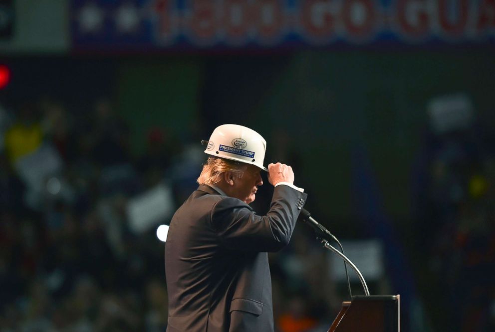 PHOTO: Republican presidential candidate Donald Trump wears a coal miners hat while addressing his supporters during a rally at the Charleston Civic Center on May 5, 2016 in Charleston, WVa.