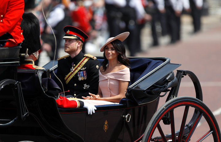 Markle in an off-the-shoulder Carolina Herrera dress at the Trooping the Colour. It's still a similar style to the boat neck 