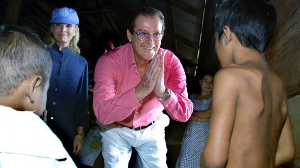 UNICEF Goodwill Ambassador and Former James Bond star Sir Roger Mooreand his wife Christina Tholstrup greet a Cambodian child at a villagenear some salt-fields in the province of Kampot, around 160 km (100miles) southwest of Phnom Penh on October 23, 2003. The popular Britishactor is in Cambodia to promote the production of iodised salt, whichcan help prevent physical and mental disabilities. It is estimated thatonly 15 percent of households in the war-scarred southeast Asian nationconsume iodised salt. REUTERS/Chor SokuntheaTW - RTR5LFQ