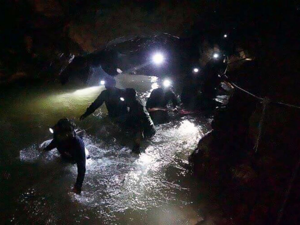 PHOTO: Thai rescue teams walk inside cave complex where 12 boys and their soccer coach went missing, in Mae Sai, Chiang Rai province, in northern Thailand, July 2, 2018.