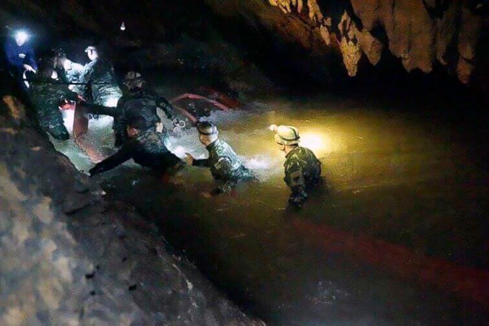 PHOTO: Rescue teams walk inside cave complex where 12 boys and their soccer coach went missing, in Mae Sai, Chiang Rai province, in northern Thailand, July 2, 2018.