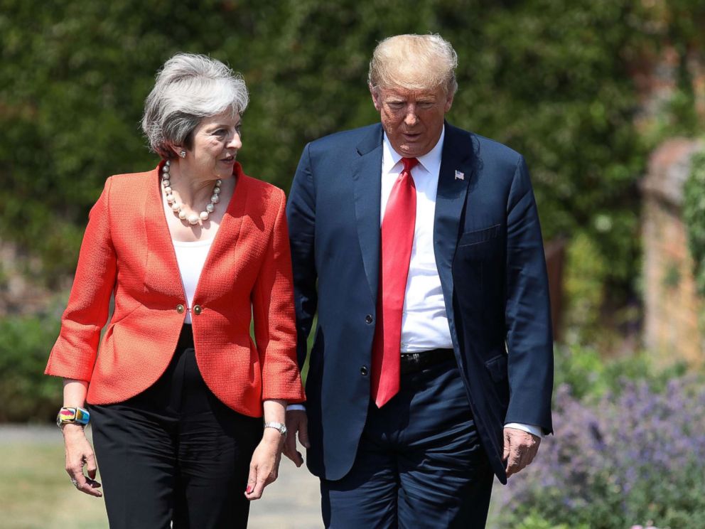 PHOTO: Prime Minister Theresa May walks with President Donald Trump at Chequers, July 13, 2018, in Aylesbury, England.