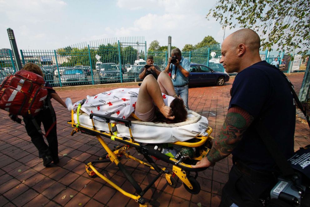 PHOTO: An unidentified person is escorted to an ambulance at the scene where a tourist boat carrying 37 people overturned on the Delaware River when a barge hit it in Philadelphia, July 7, 2010. 